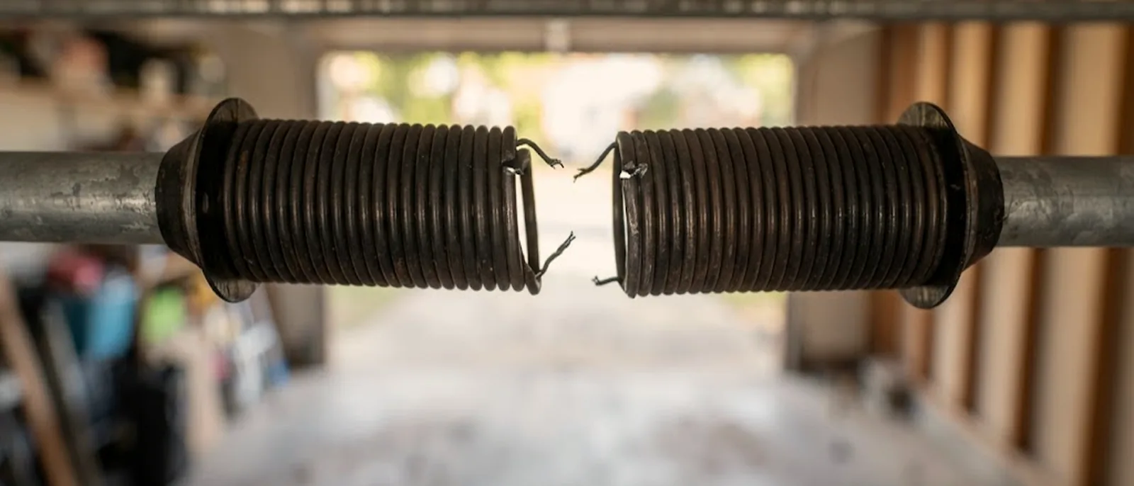 Broken torsion spring above a garage door in Brownsville